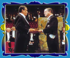 Derek Walcott receives his Nobel Prize for Literature from the King of Sweden King Karl XVII Gustaff - in December 1992.